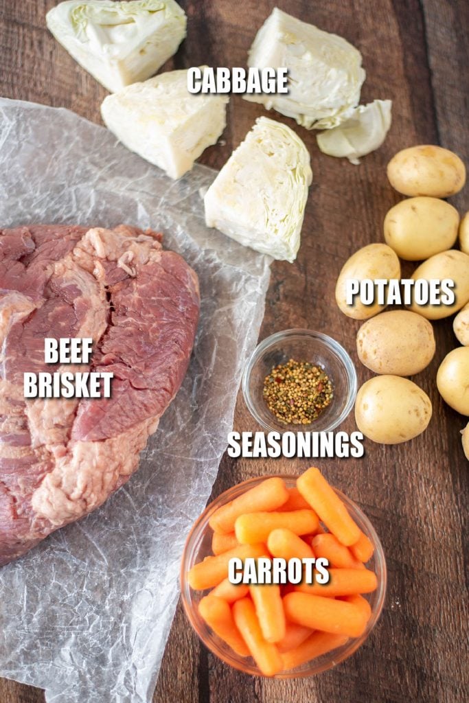 overhead shot of corned beef, carrots, potatoes, and cabbage ready to cook