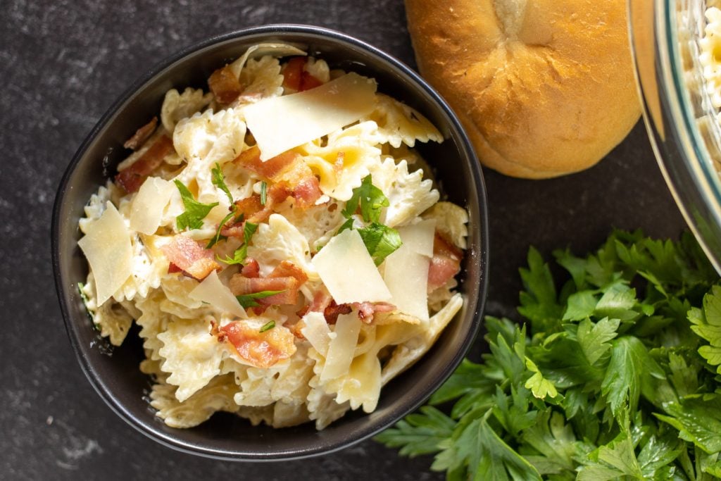 overhead shot of black bowl filled with pasta