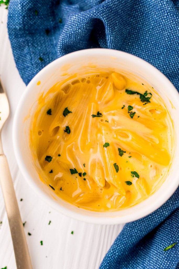 overhead shot of mac n cheese in a white mug