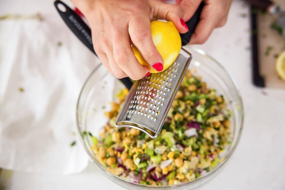 Liz zesting a lemon.