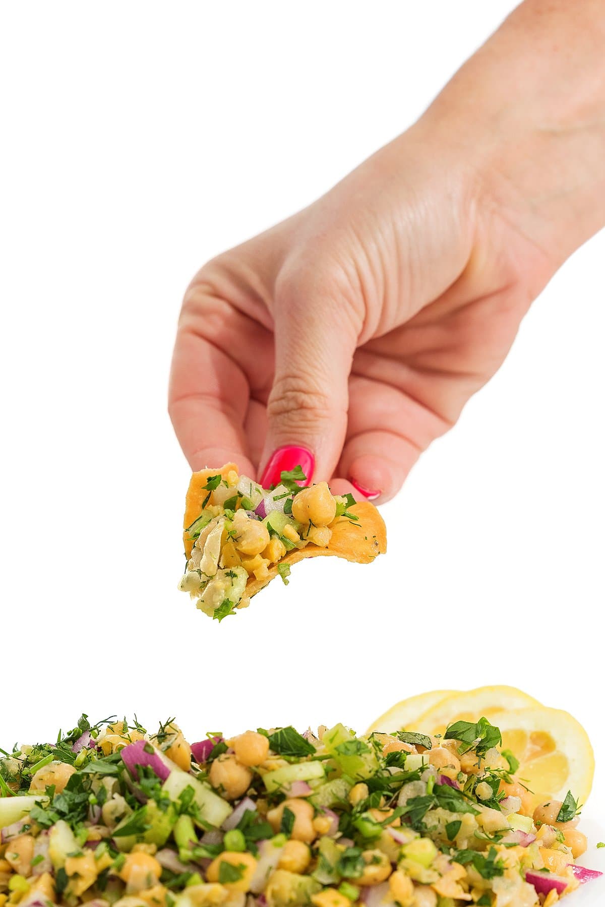 Serving smashed chickpea salad with dill.