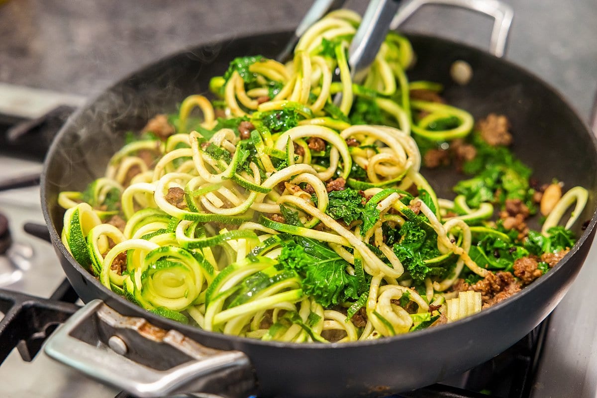 adding zucchini to pot