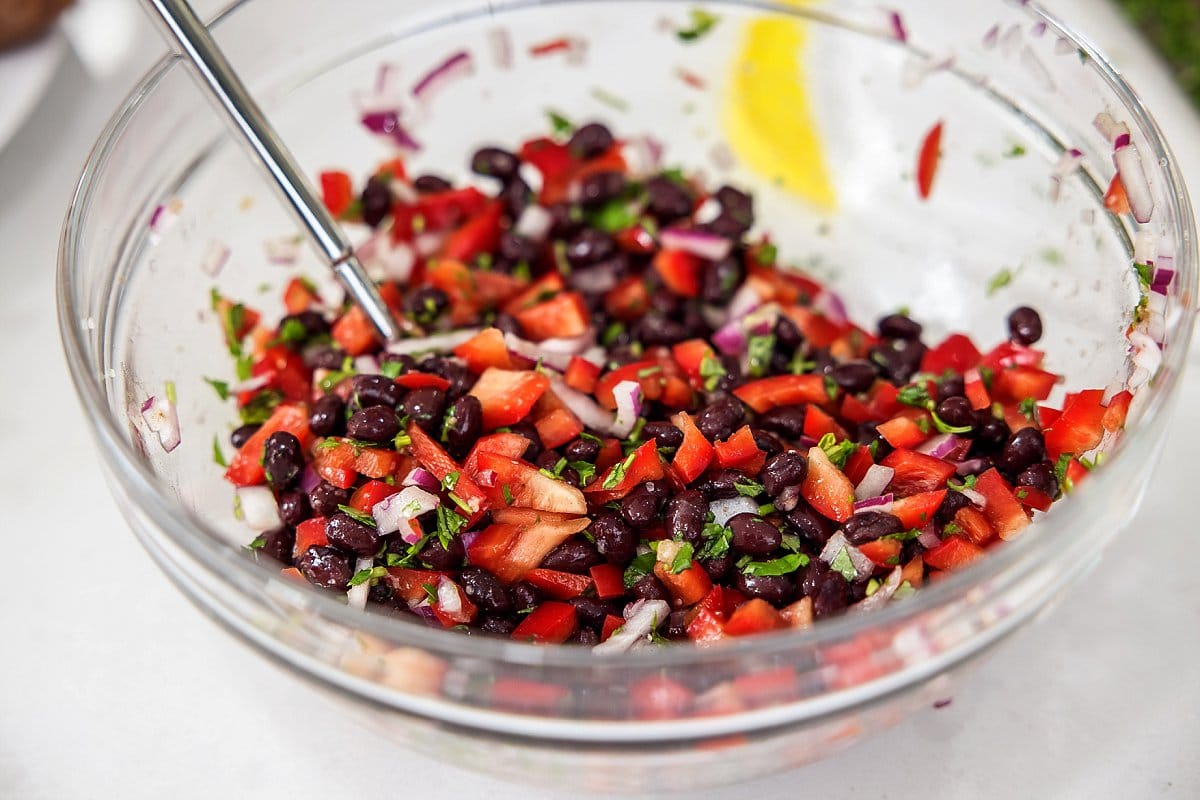 mixing black beans for sweet potatoes