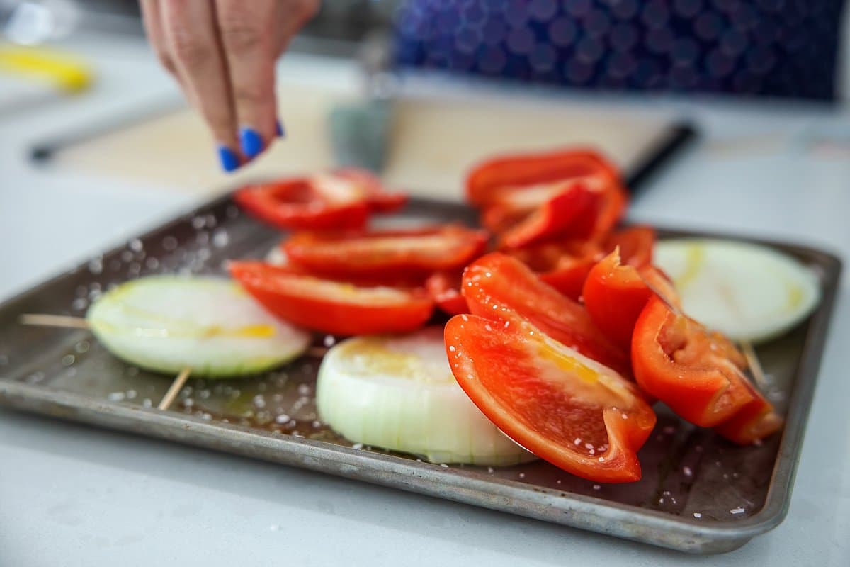 preparing onions bell peppers