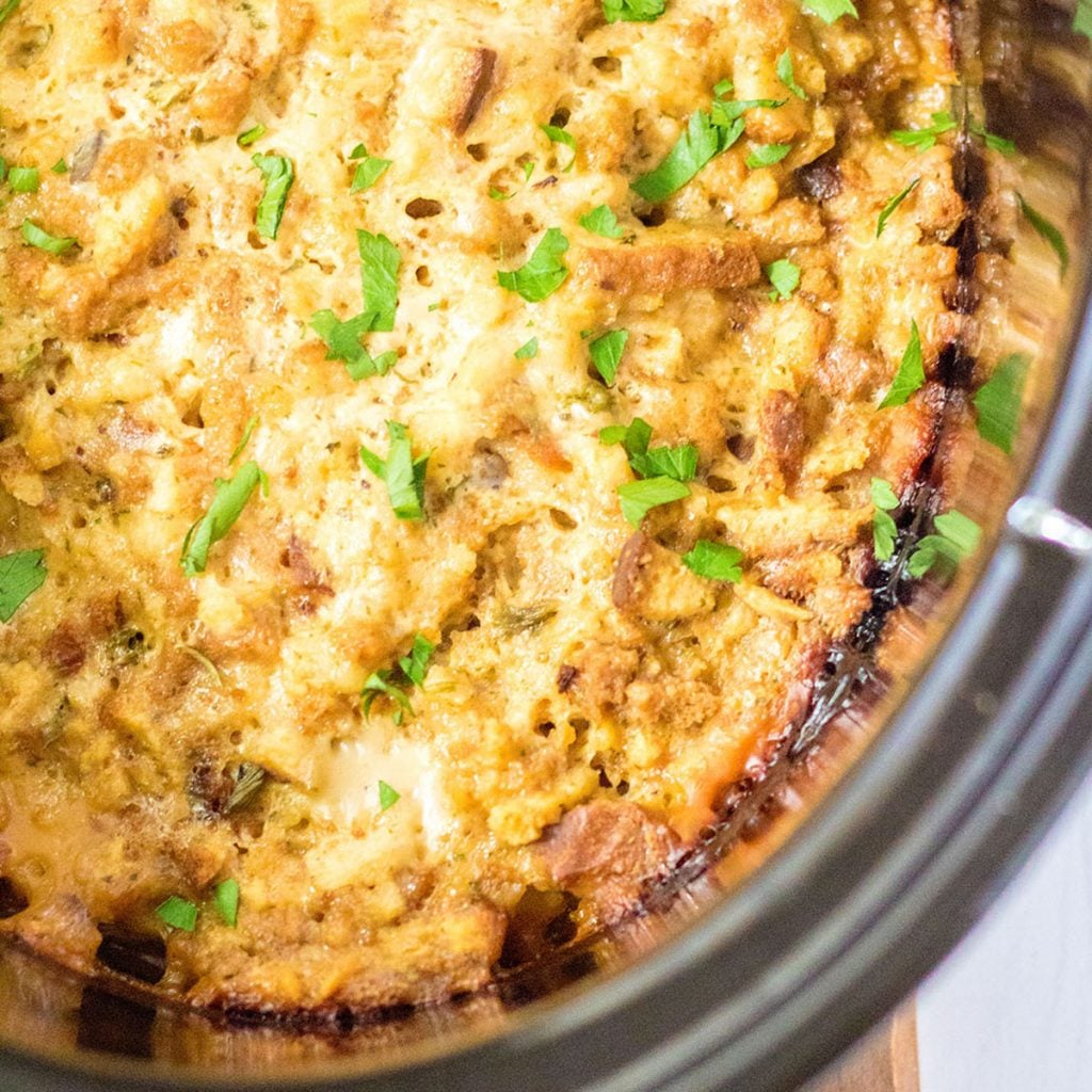 overhead shot of crockpot turkey stuffing casserole in a slow cooker