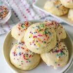 italian sugar cookies with rainbow sprinkles on a plate.