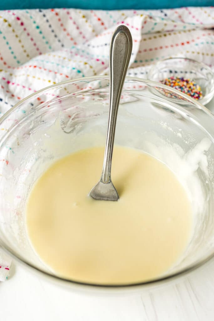 icing in a bowl with a fork.