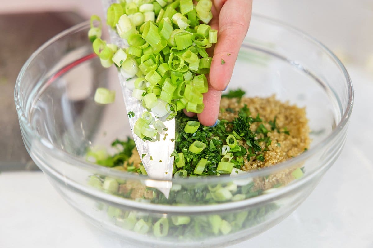 Adding scallions to bowl