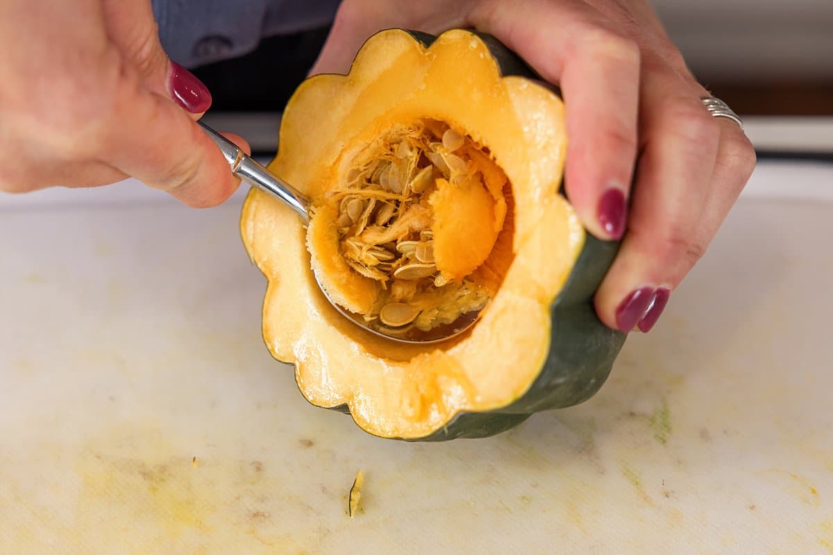 Liz cleaning out acorn squash.