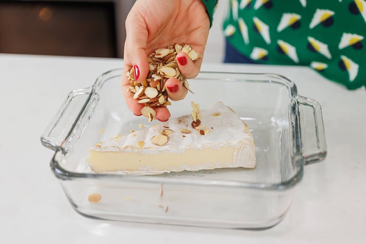 A piece of brie sitting in a pyrex dish