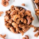 overhead shot of cinnamon sugar candied cashews in a white bowl