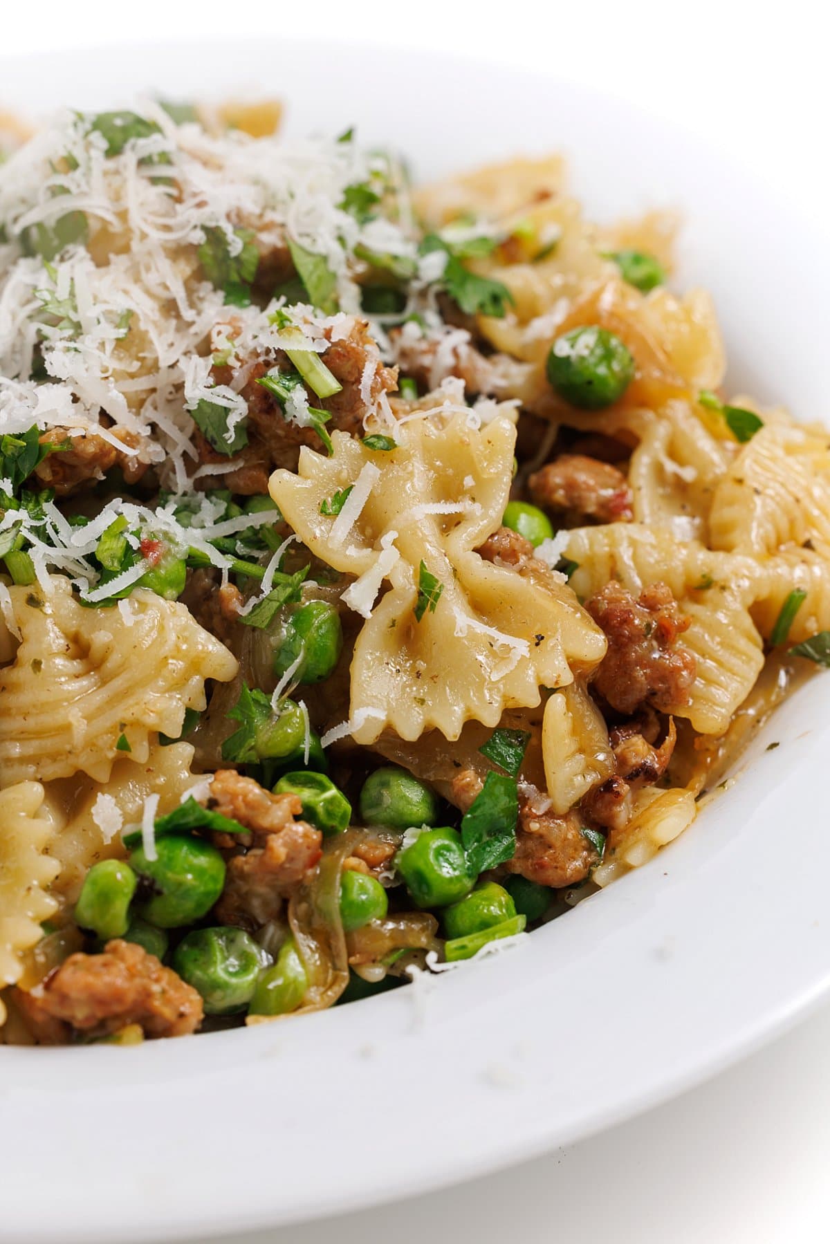 Sausage pesto pasta with caramelized onions and peas.
