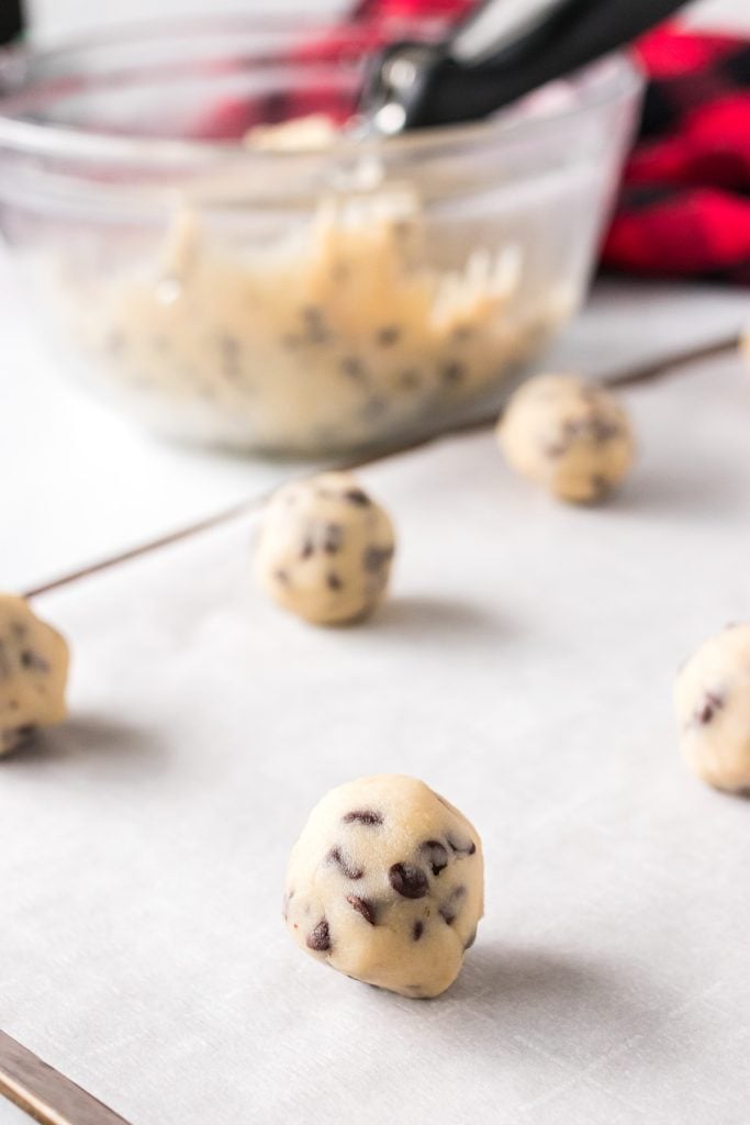 chocolate chip cookie dough balls on a baking sheet