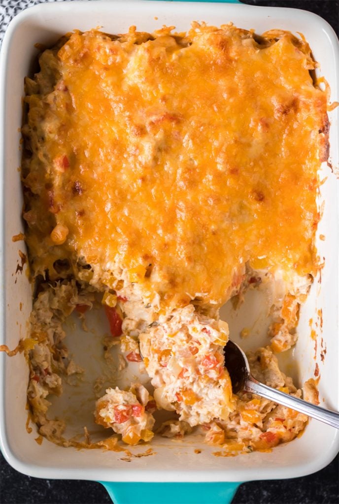 spoon scooping chicken fajita casserole out of a