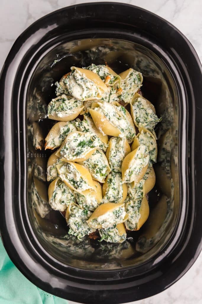 overhead shot of cheese stuffed shells in a crockpot.