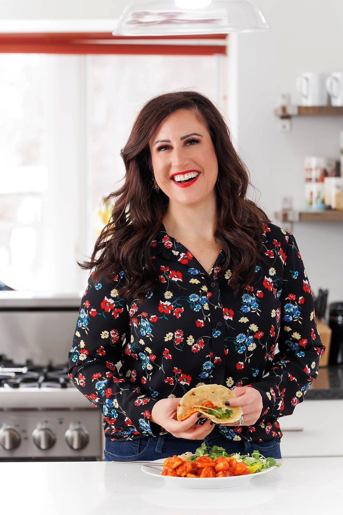 Liz eating authentic tequila lime shrimp.