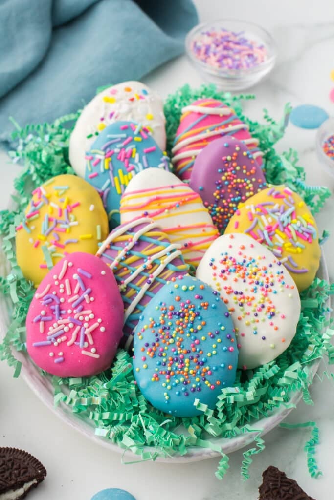 platter of colorful easter egg oreo truffles on easter grass.