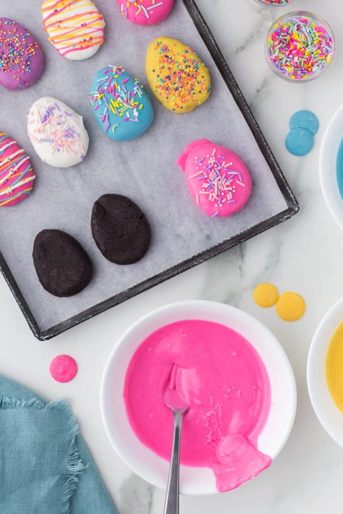 baking sheet of oreo truffles topped with sprinkles.