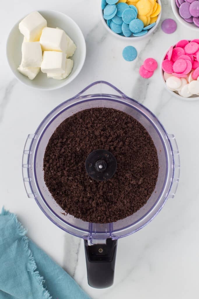 overhead shot of crushed oreos in a food processor.