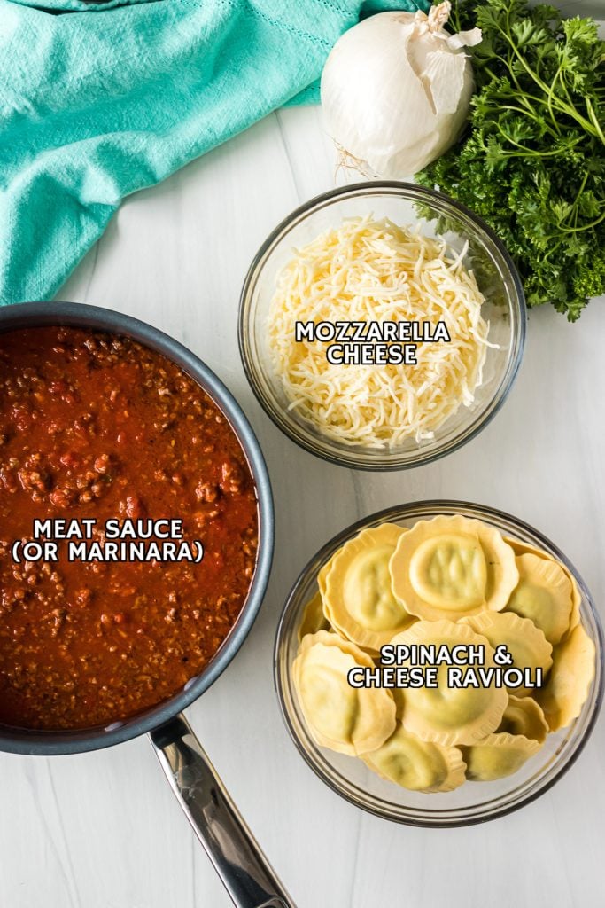 overhead shot of labeled ingredients laid out to make ravioli lasagna.