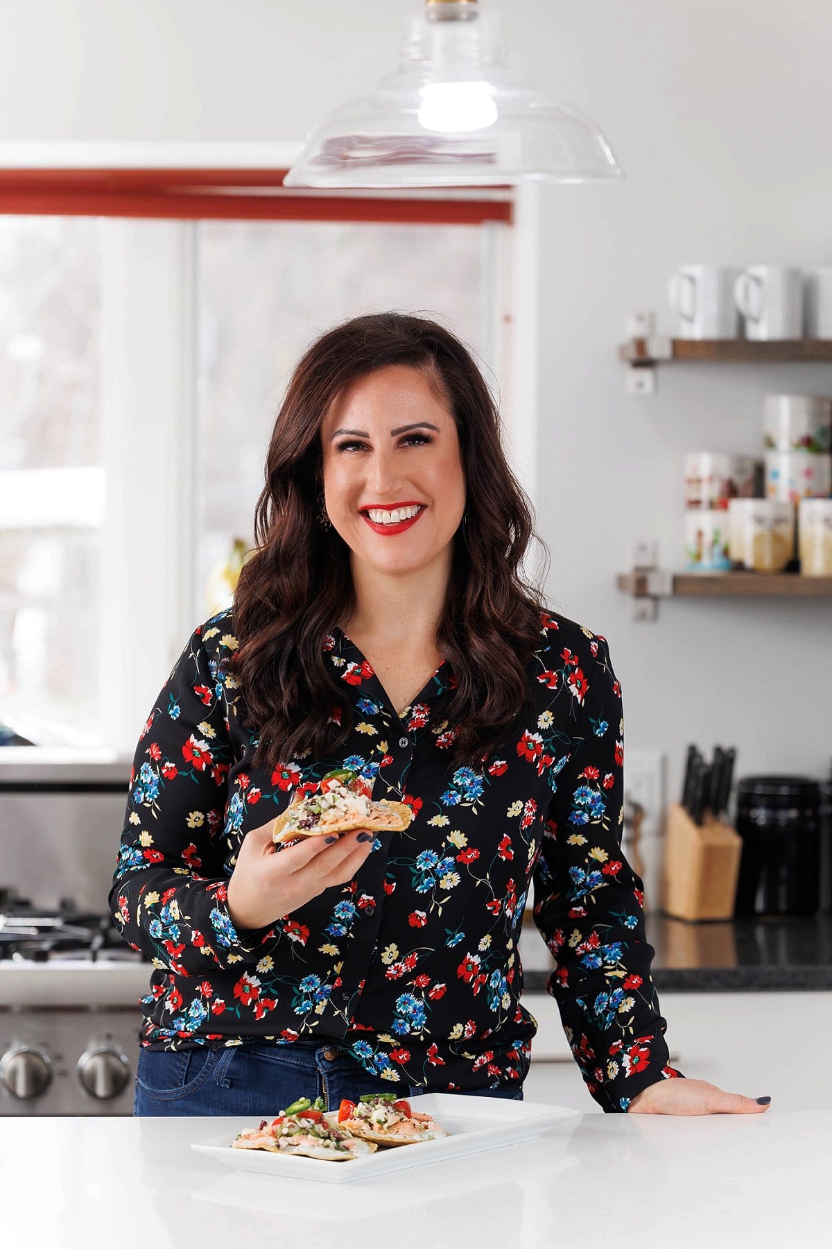 Liz eating Greek Salmon Tostadas