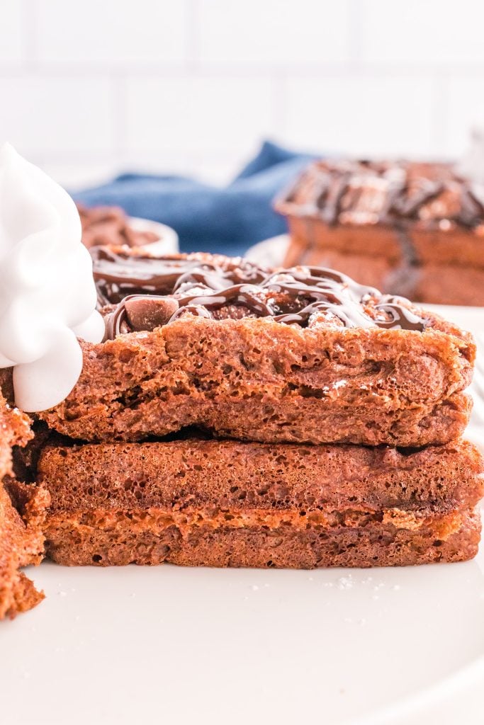 side view of thick & fluffy belgian chocolate waffles. 