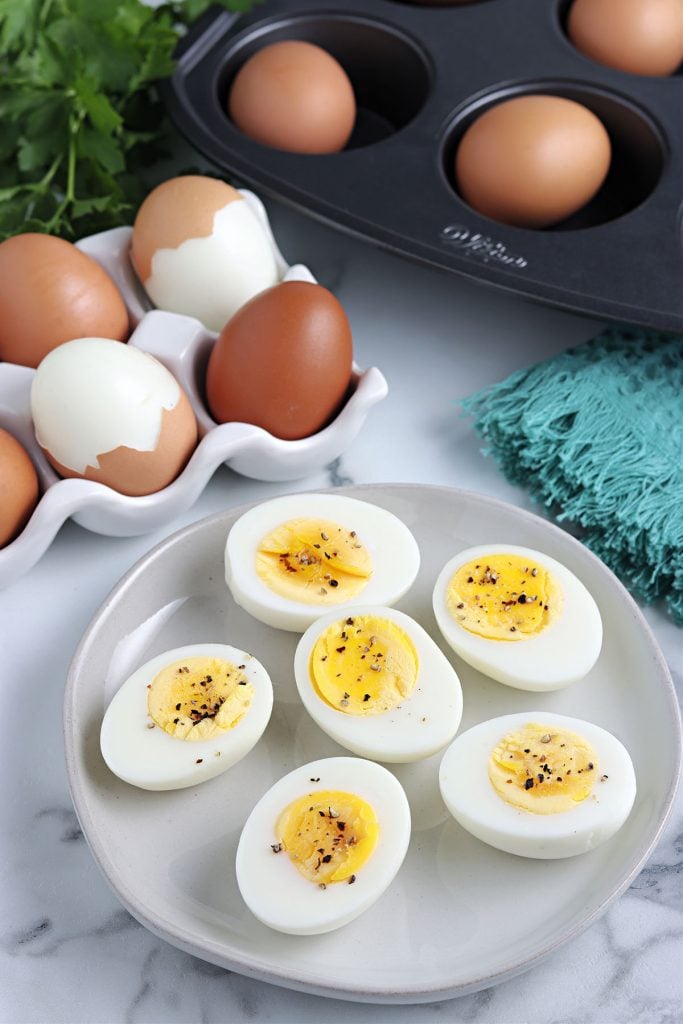 plate of sliced hard boiled eggs on a plate. 