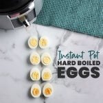 sliced eggs with text overlay reading "instant pot hard boiled eggs".