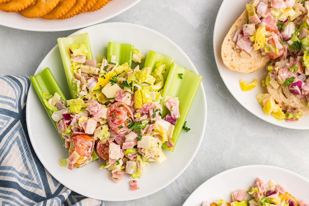 overhead shot of hoagie dip with celery, crackers, and bread.