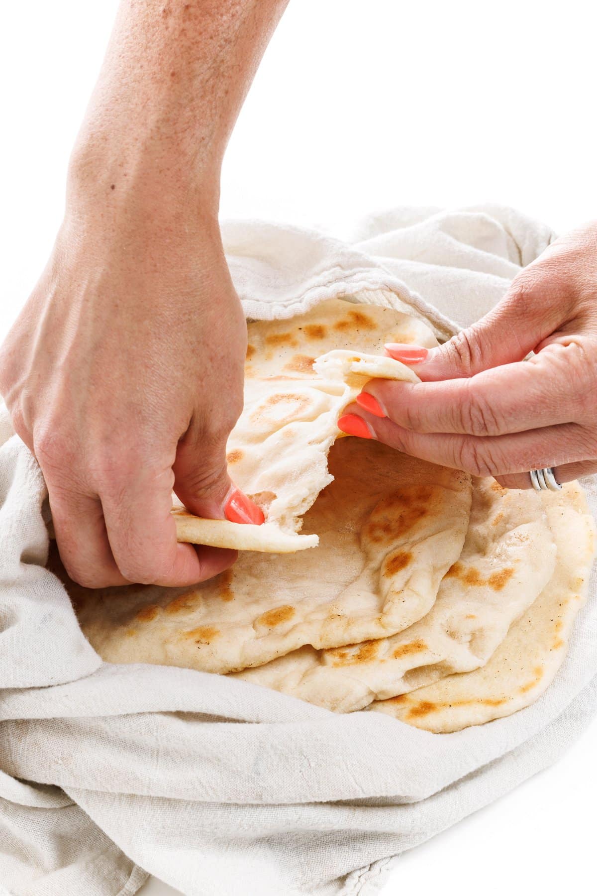 Tearing up restaurant style pita bread.