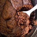 spoon scooping lava cake from a crockpot.