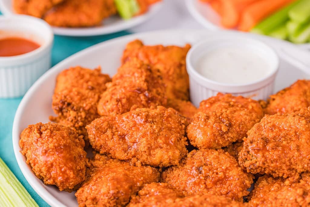 plate of boneless wings on a plate with ranch dipping sauce.