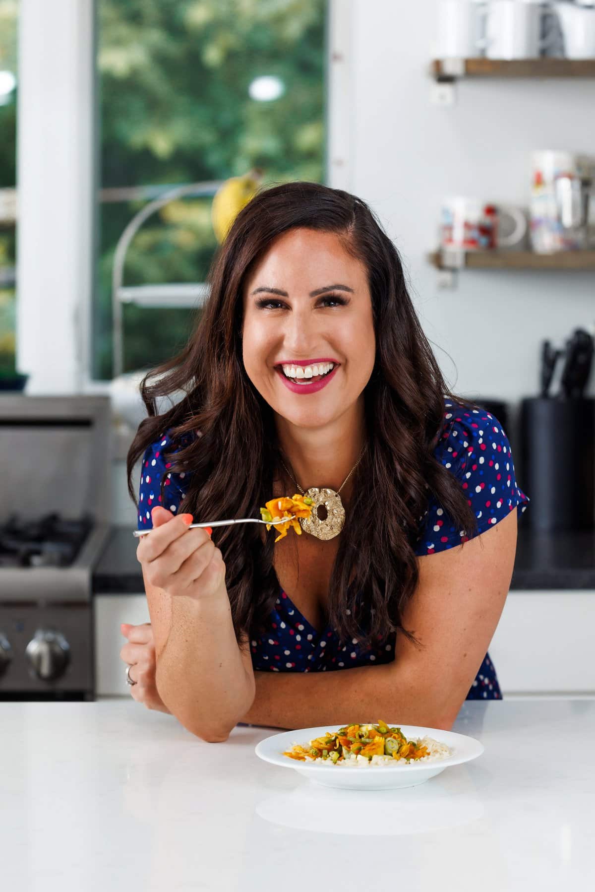 Liz eating slow cooker chicken curry.