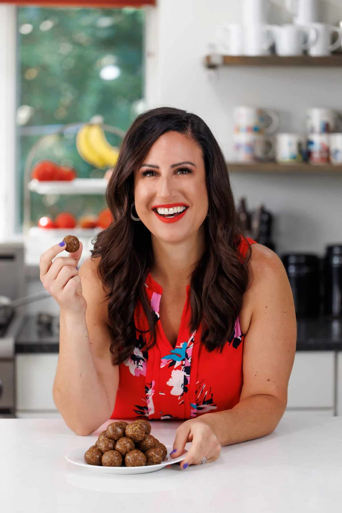 Liz enjoying 5-ingredient no bake fig newton bites.