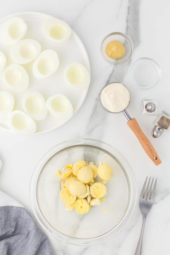 hard boiled egg centers in a mixing bowl.