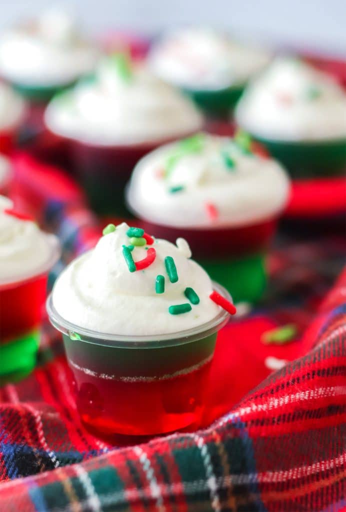 christmas jello shots on a red plaid napkin.