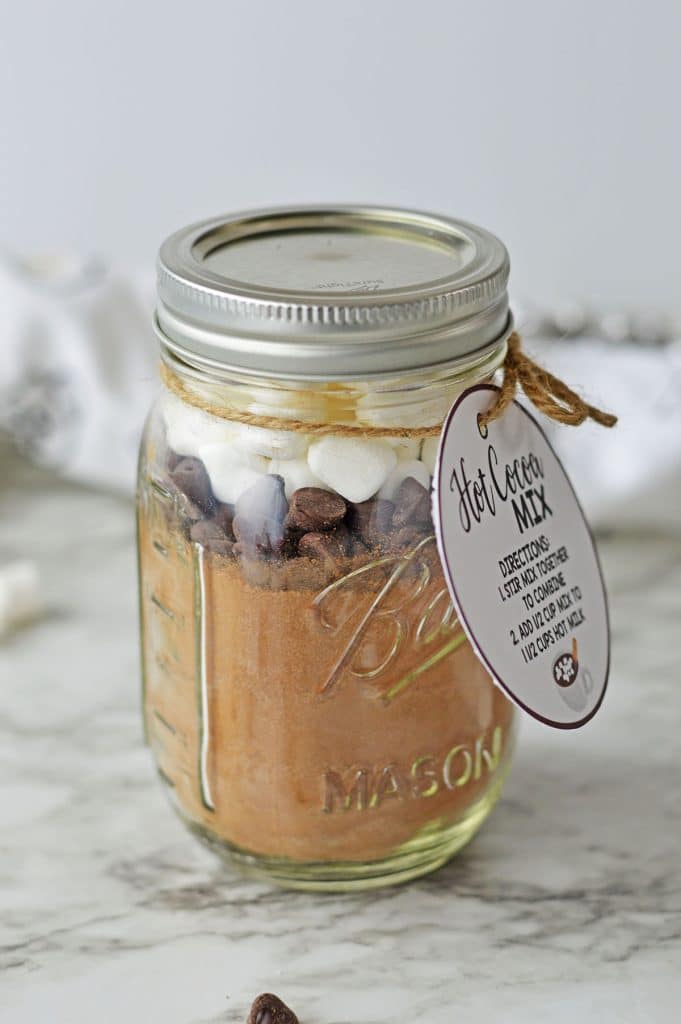 mason jar of layered homemade hot cocoa mix.