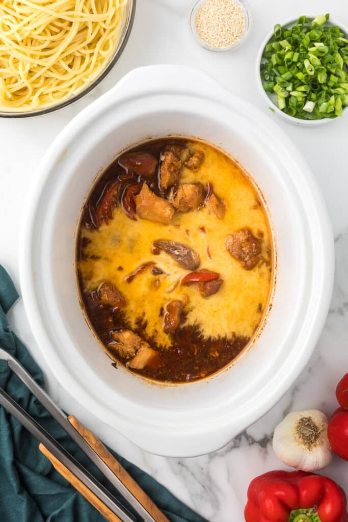 cornstarch slurry poured into a slow cooker.