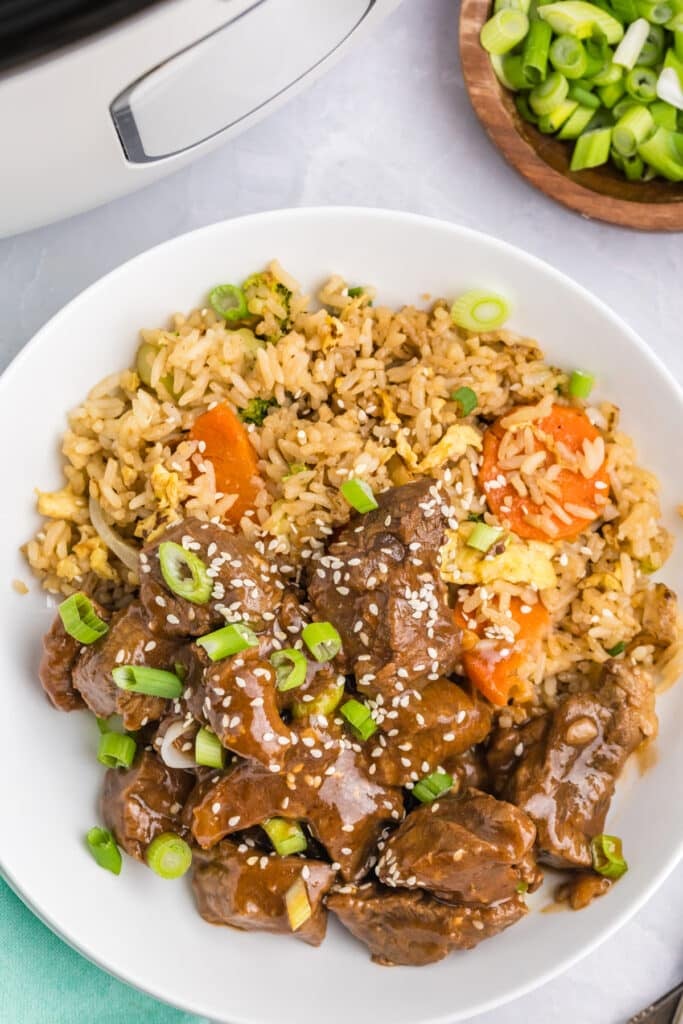 plate of steak bites with fried rice.