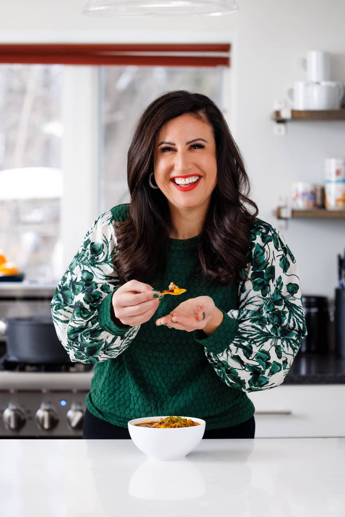 Liz enjoying slow cooker healthy turkey chili.