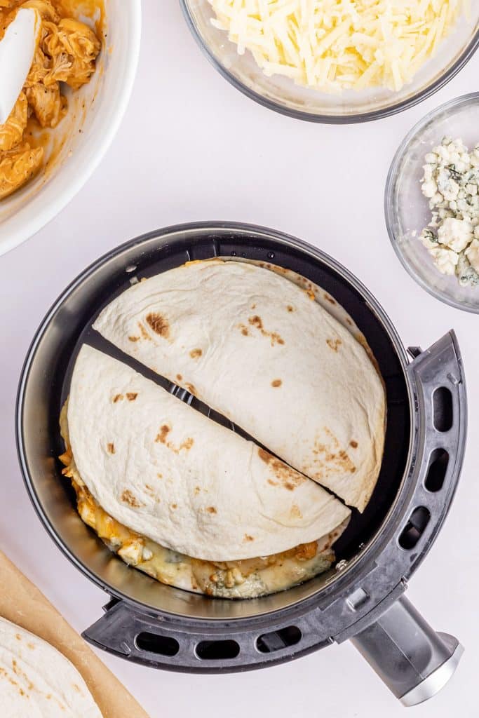 overhead shot of a quesadilla in an air fryer.