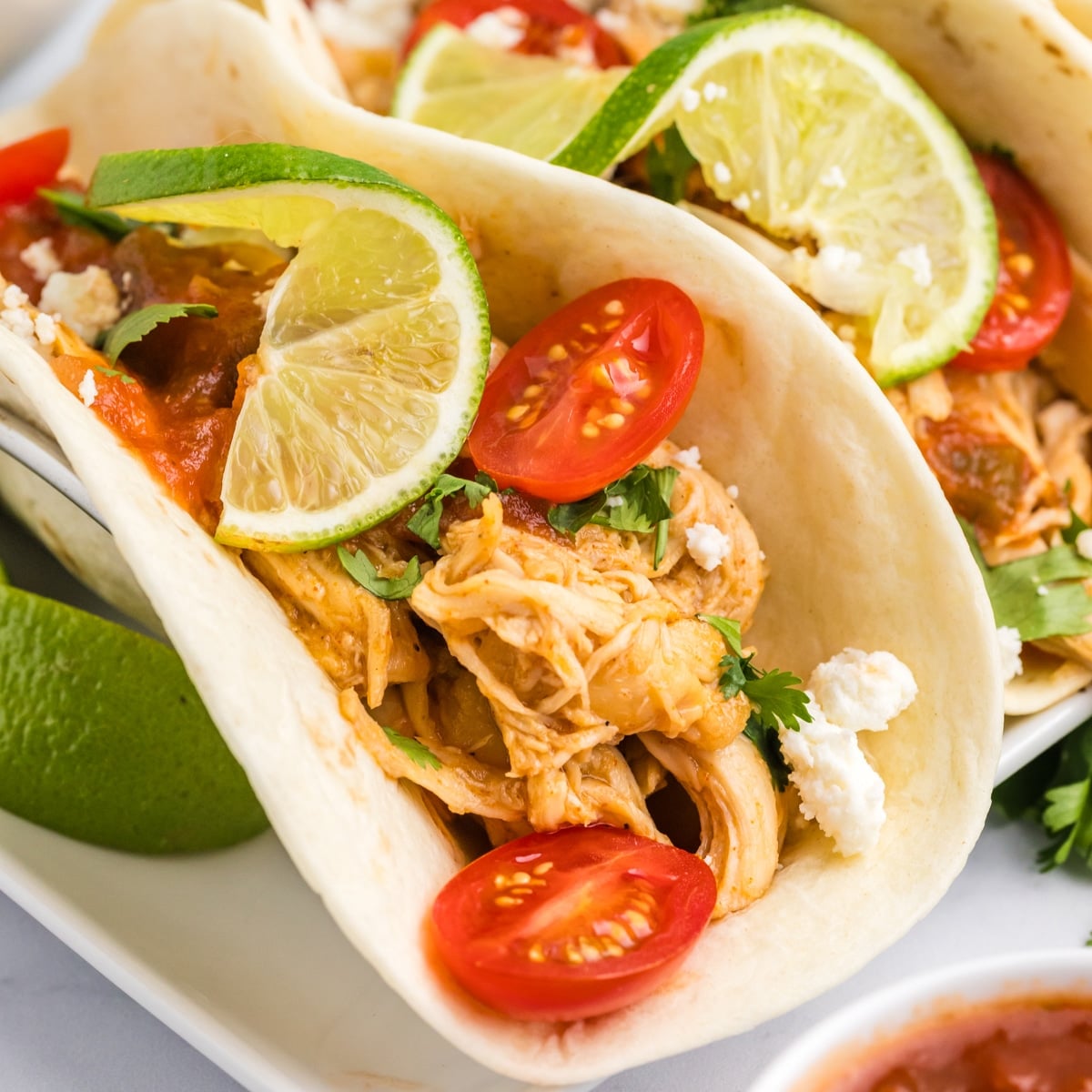 honey lime chicken tacos on a plate.