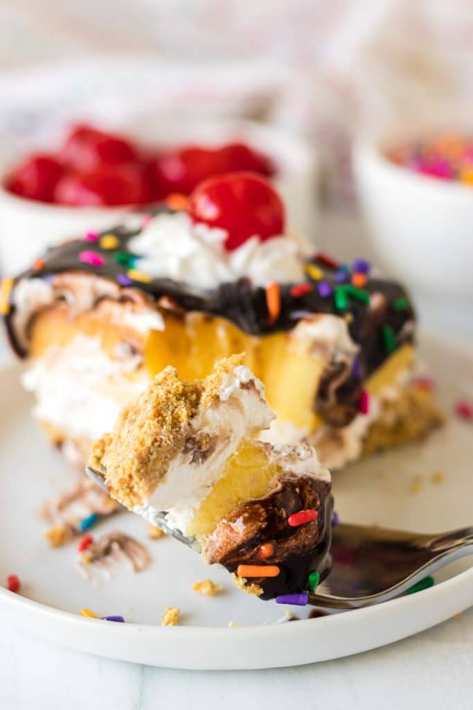 bite of banana split dessert on a fork.