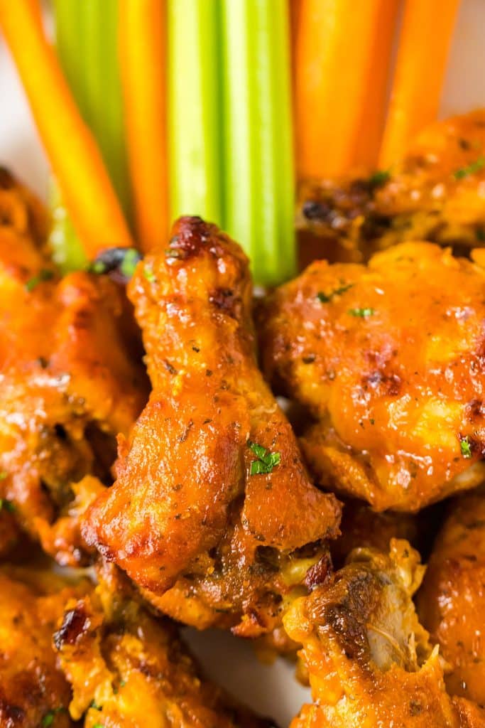buffalo ranch chicken wings with celery sticks & carrot sticks.
