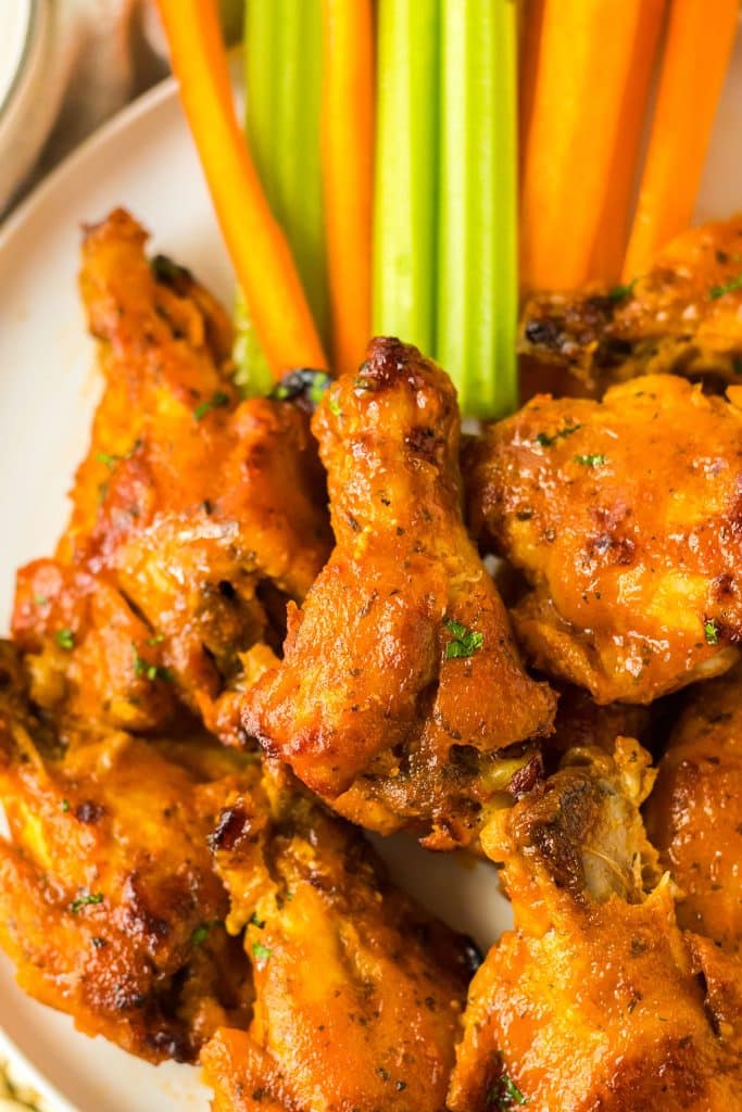 overhead shot of a plate of buffalo ranch chicken wings.