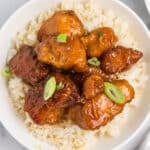 overhead shot of firecracker chicken over white rice.
