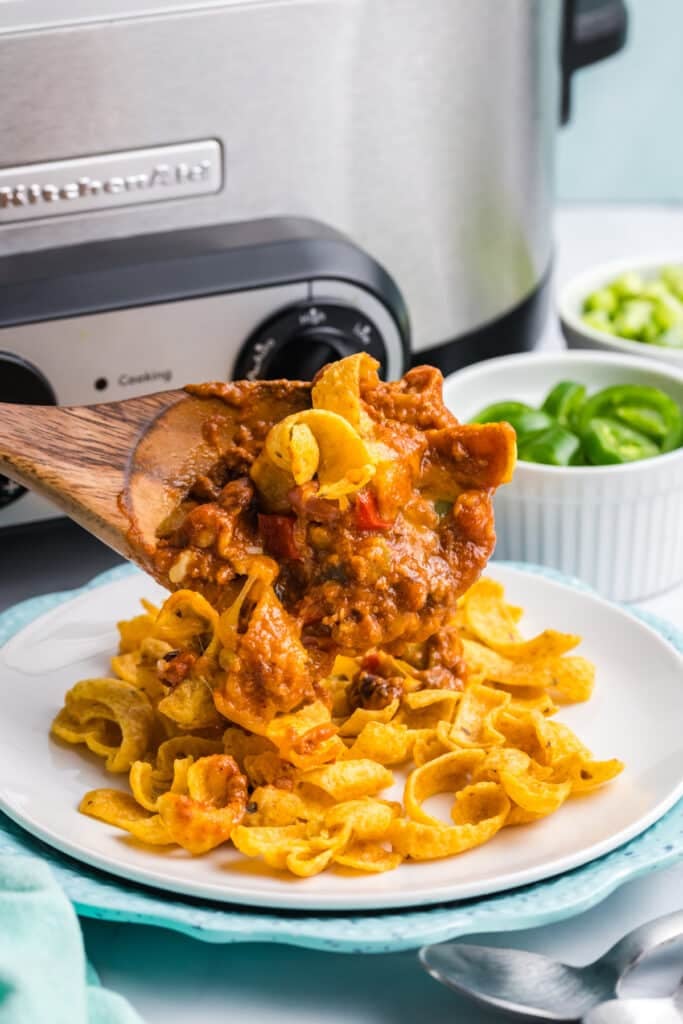 scoop of frito pie on frito chips.