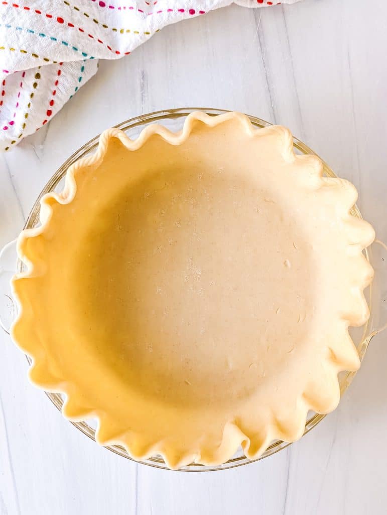 overhead shot of crust in a pie plate.