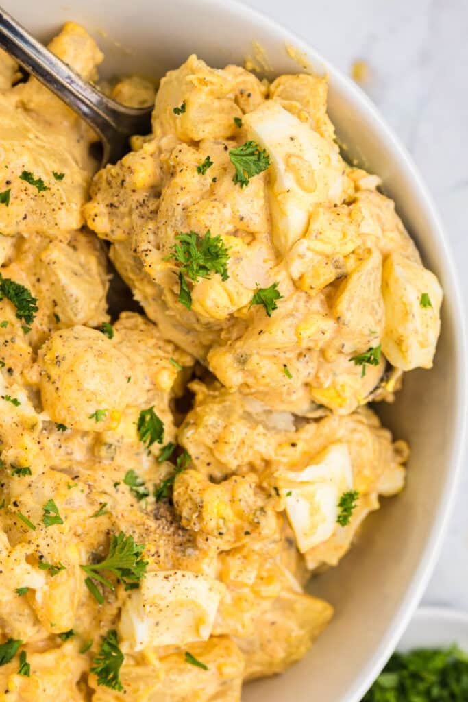 overhead shot of a bowl of deviled egg potato salad.