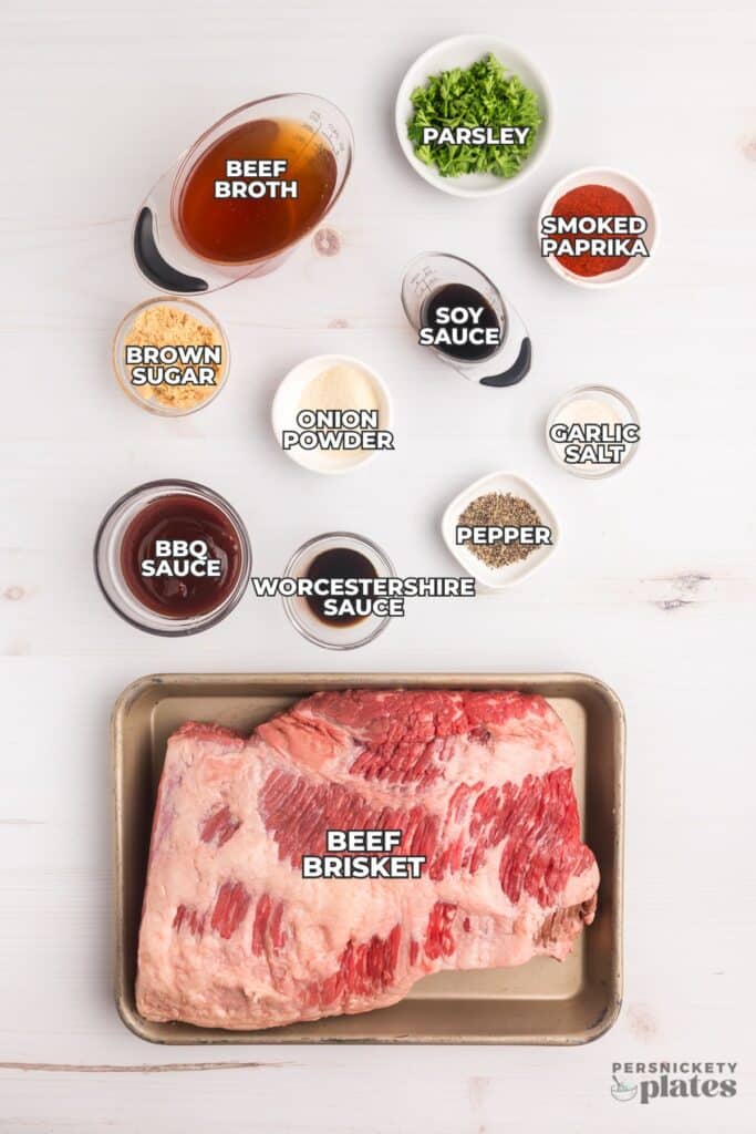 Labeled ingredients for slow cooker beef brisket arranged on a white surface.